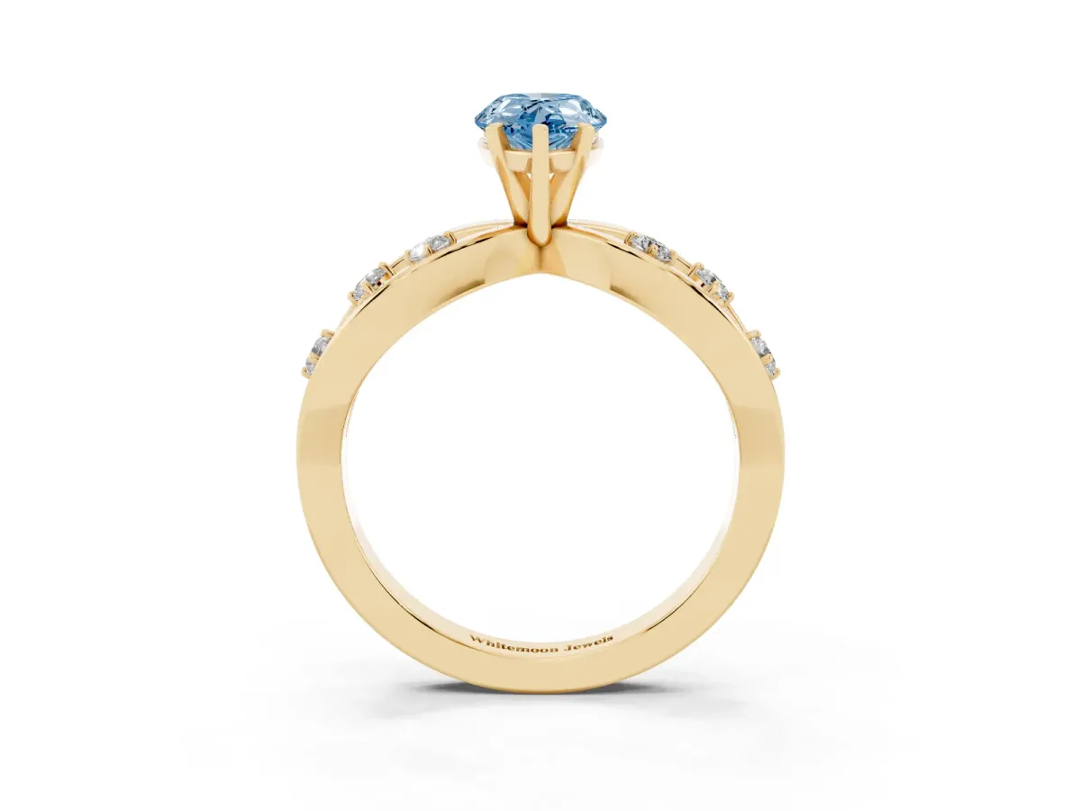 Fancy Blue Pear Cut Cut Solitaire Diamond with Side Stones on Criss-Cross Band and Four-Prong Setting Yellow gold