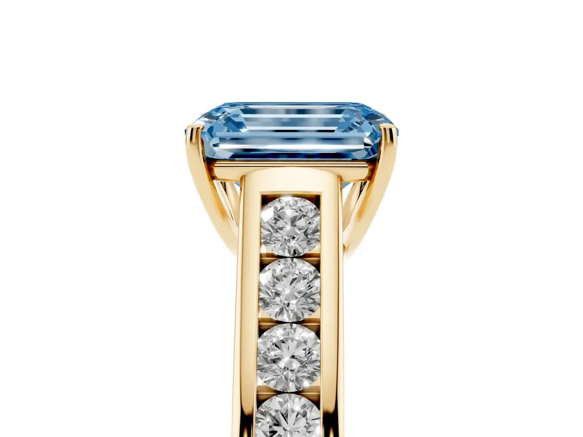 Fancy Blue Emerald Cut Brilliant Channel-Set Solitaire Ring with Four-Prong Setting Yellow gold