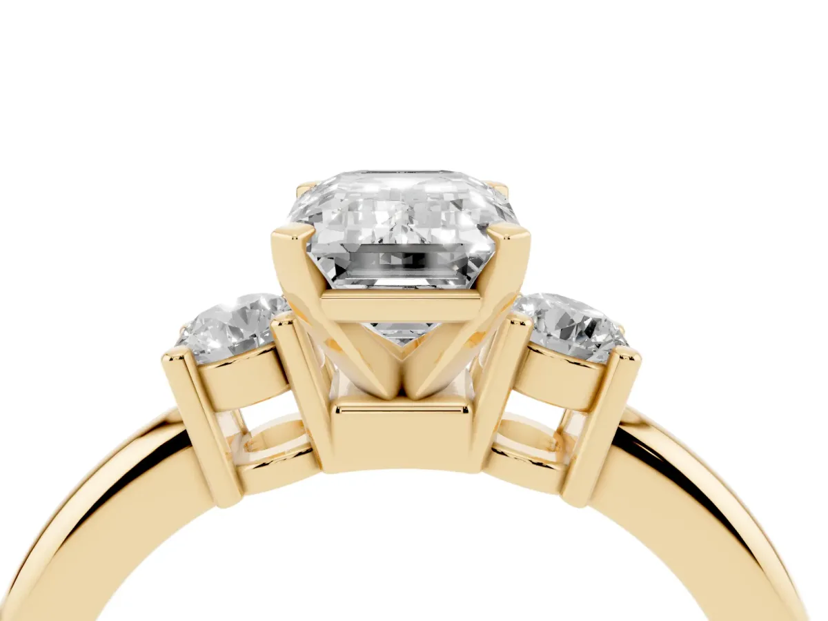 Three-Stone Emerald Cut Cut Diamond Solitaire with Prong Setting and Classic Band Yellow gold