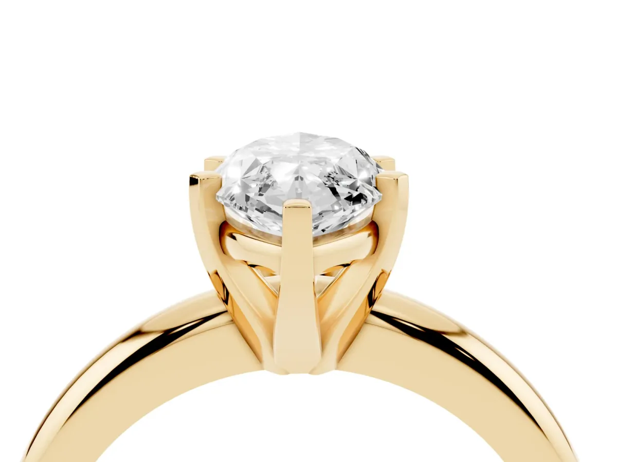 Marquise Cut Diamond Solitaire Engagement Ring with Round Band and Four-Prong Setting Yellow gold