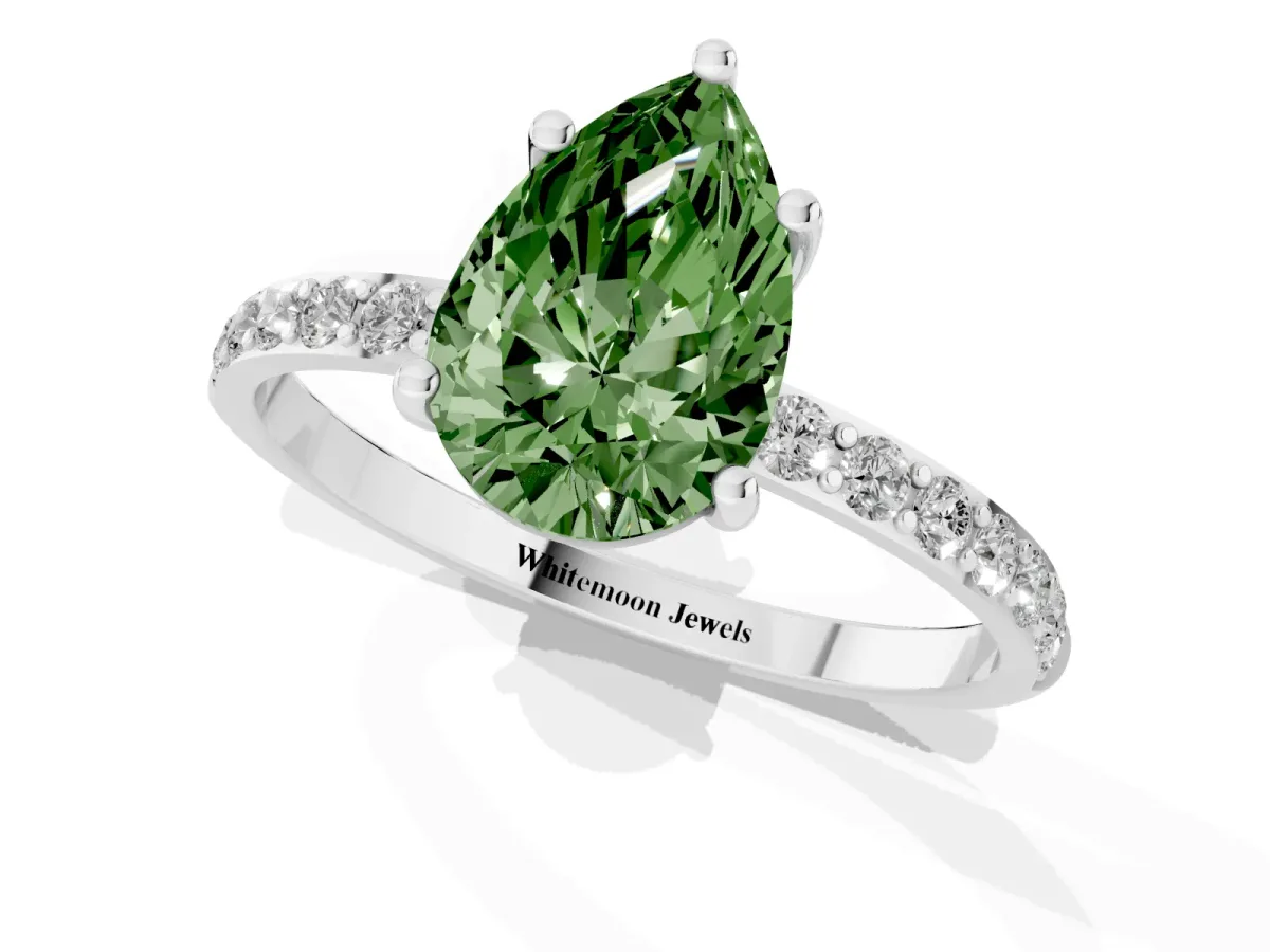 Fancy Green Pear Cut Diamond Solitaire Ring with Round Pavé Shoulders and Prong Setting Silver