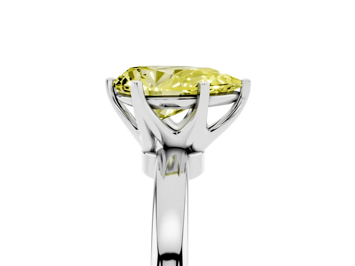 Fancy Yellow Pear Cut Solitaire Diamond Ring with Six-Prong Setting on a Classic Band Silver