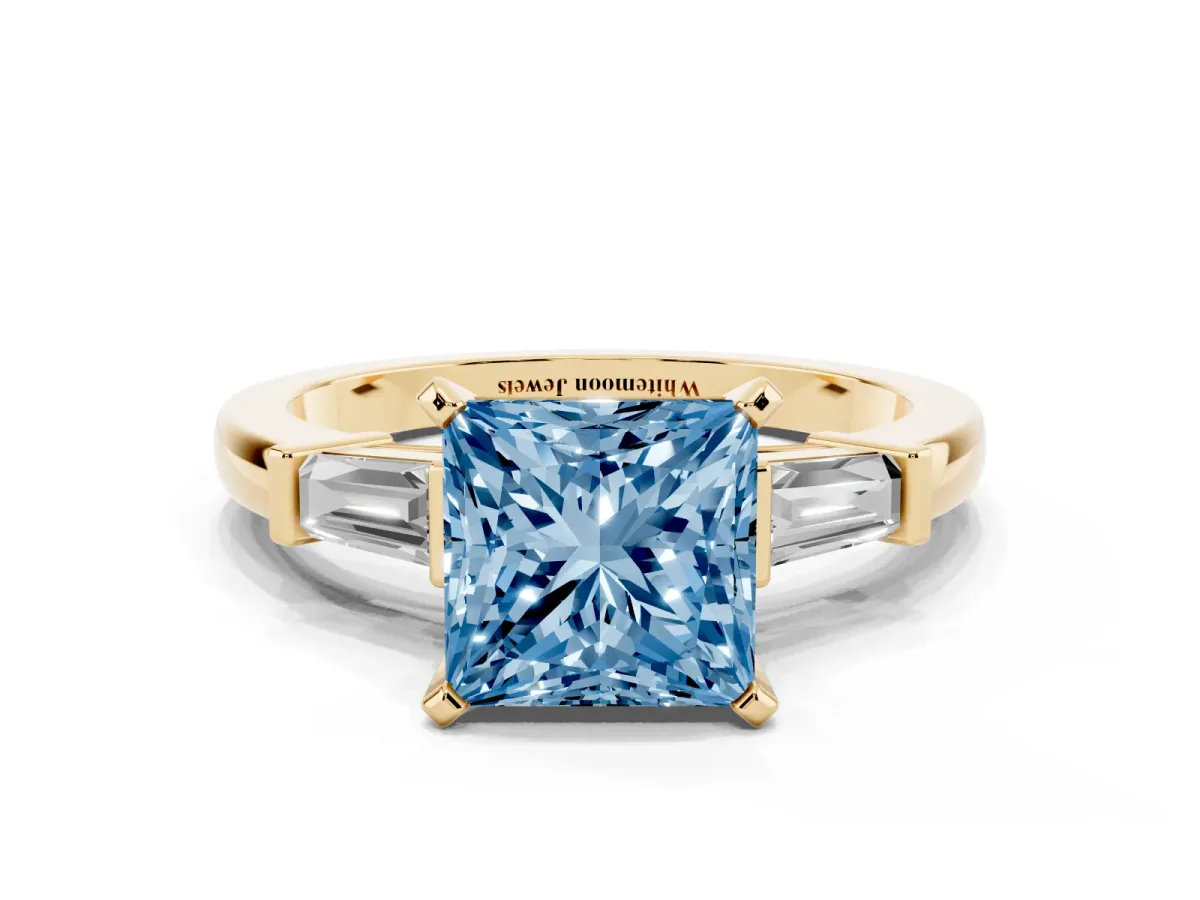 Fancy Blue Princess Cut Cut Diamond Solitaire Ring with Tapered Baguette Accents and Four-Prong Setting Yellow gold