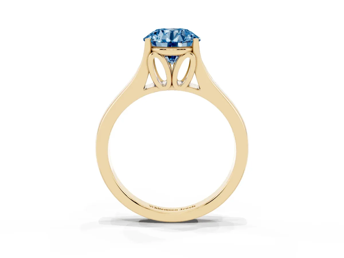 Fancy Blue Round Cut Solitaire Diamond Ring with Cathedral Band and Four-Prong Setting Yellow gold