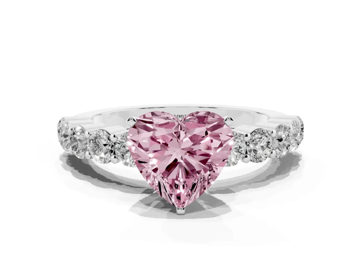 Fancy Pink Heart Cut Diamond Solitaire Ring with Shared Prong Round Side Stones Silver
