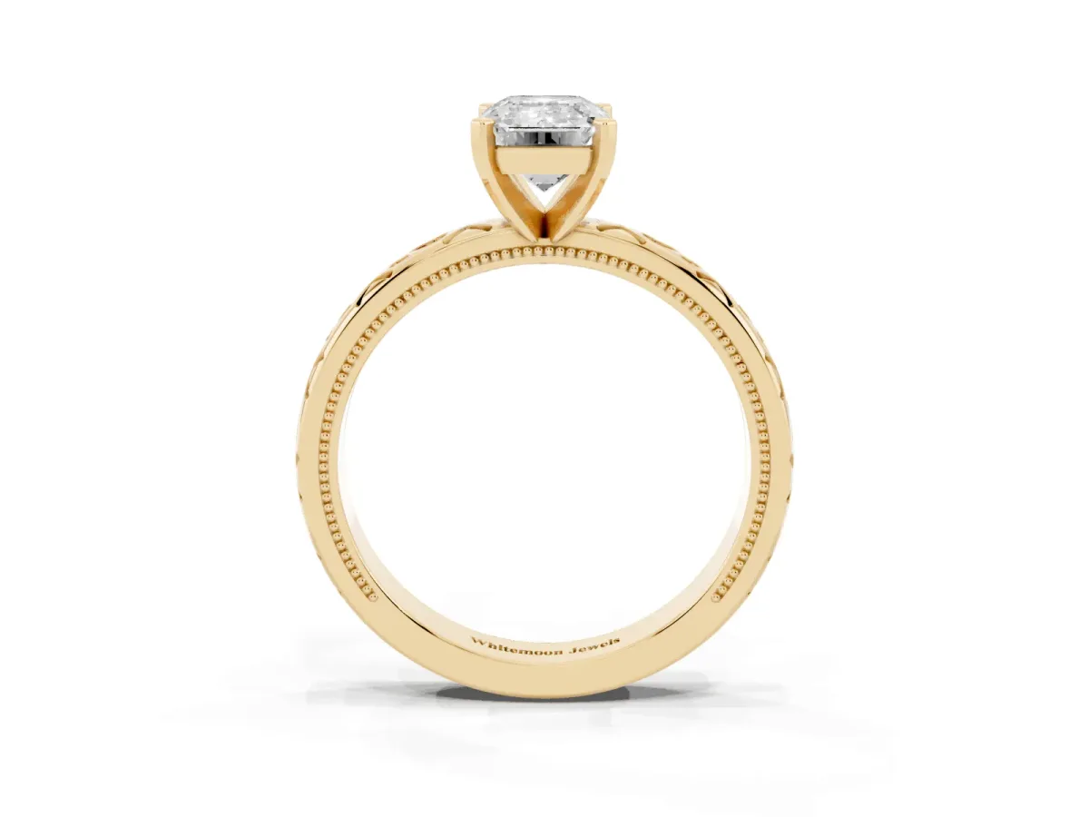 Emerald Cut Solitaire Engagement Ring with Scrollwork Band and Four-Prong Setting Yellow gold
