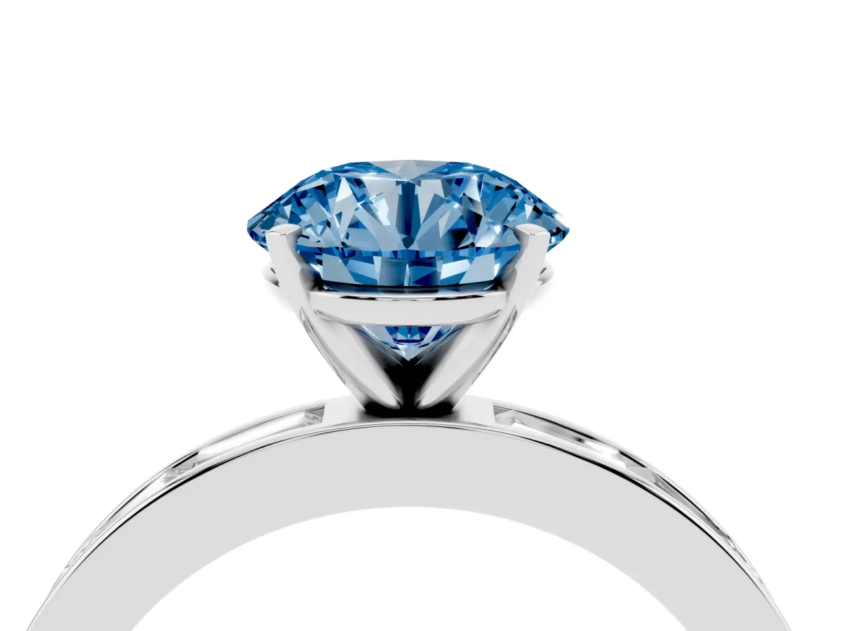 Fancy Blue Round Cut Solitaire Diamond Ring with Channel-Set Baguette Band and Four-Prong Setting White gold