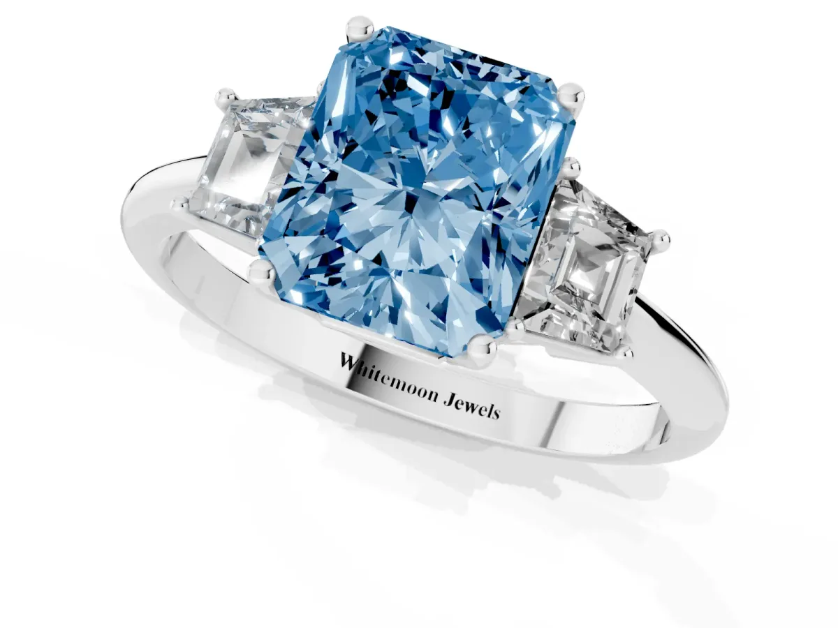 Fancy Blue Radiant Cut Diamond Three-Stone Ring with Trapezoid Side Stones and Prong Setting Silver