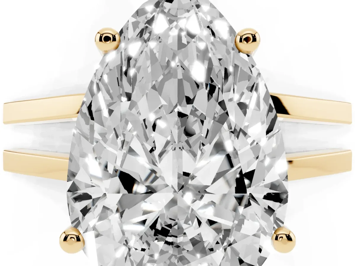 Pear Cut Cut Diamond Solitaire Engagement Ring with Tapered Plain Band and Four-Prong Setting Yellow gold