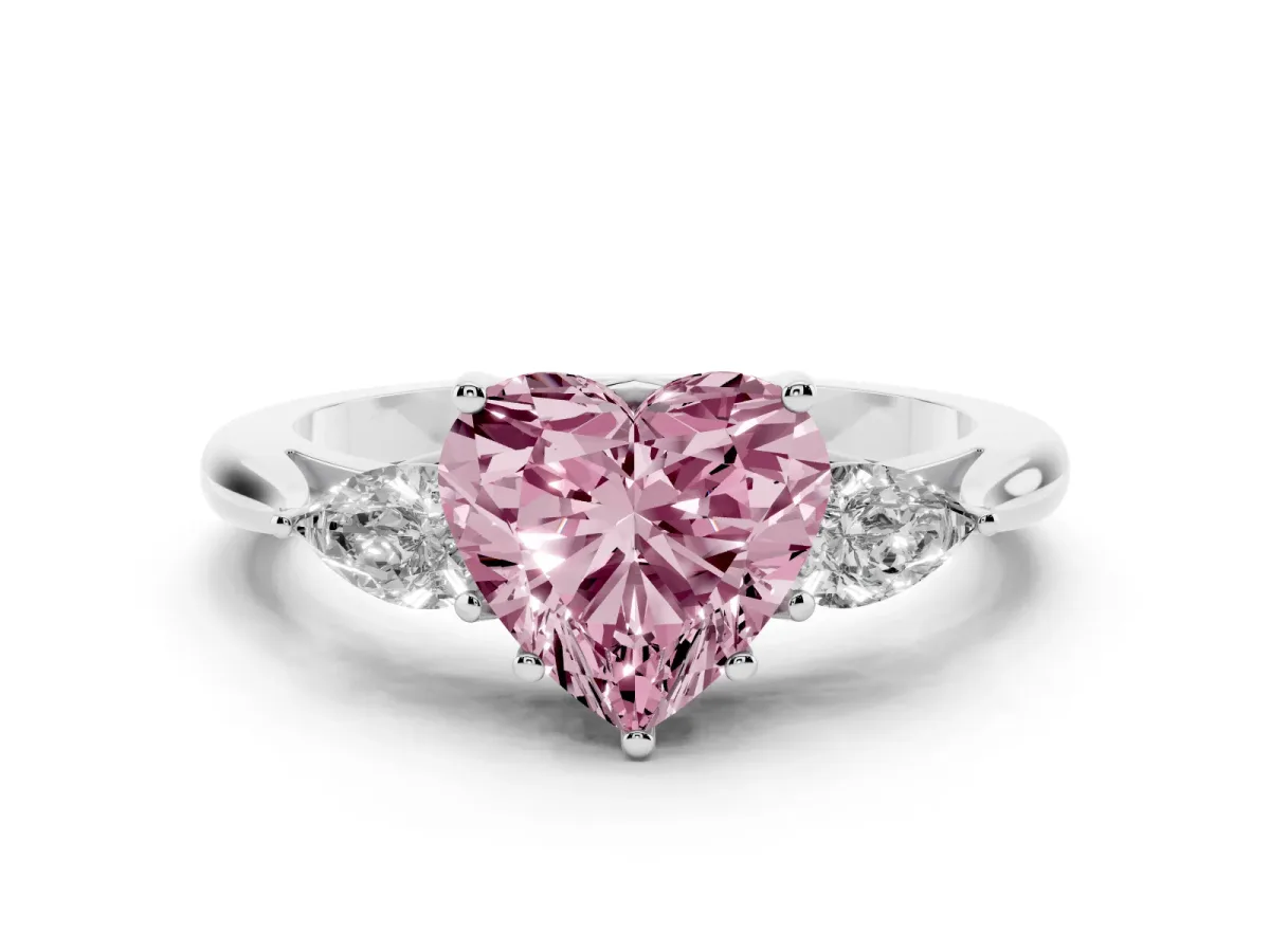 Fancy Pink Three-Stone Heart Cut Brilliant Diamond Solitaire Ring with Tapered Band and Four-Prong Setting White gold