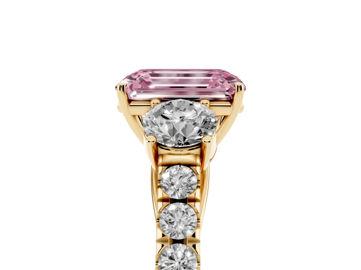 Fancy Pink Emerald Cut Cut Diamond Three-Stone Ring with Round Side Stones and Pavé Band Yellow gold
