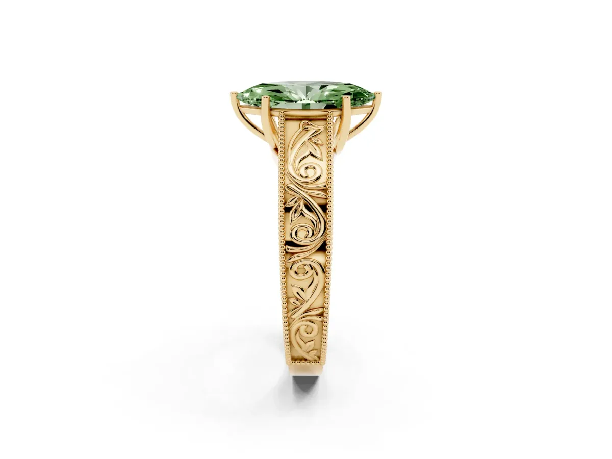 Fancy Green Marquise Cut Diamond Solitaire Ring with Engraved Band and Four-Prong Setting Yellow gold