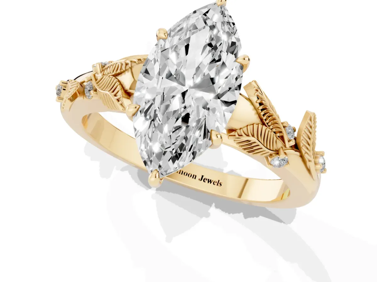 Marquise Cut Diamond Solitaire Ring with Leaf Motif Band and Four-Prong Setting Yellow gold