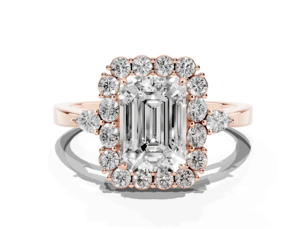 Emerald Cut Diamond Halo Ring with Pear Side Stones and Prong Setting Rose gold
