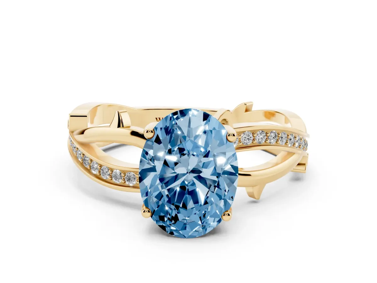 Fancy Blue Oval Cut Solitaire Twist Band with Pavé Accents and Four-Prong Setting Yellow gold
