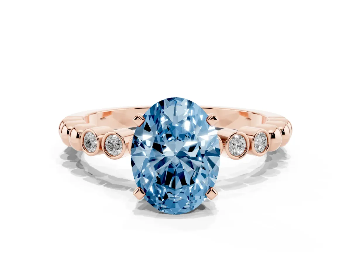 Fancy Blue Oval Cut Solitaire Bezel Accent Diamond Engagement Ring with Beaded Band and Four-Prong Setting Rose gold