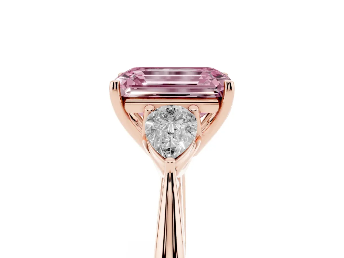 Fancy Pink Three-Stone Emerald Cut Diamond Ring with Pear Side Stones in Four-Prong Setting Rose gold