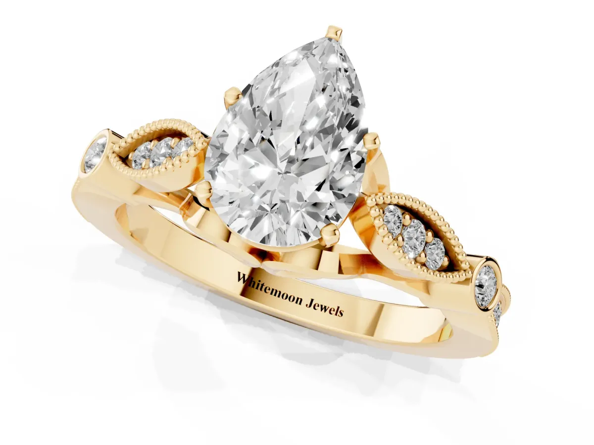 Pear Cut Cut Diamond with Milgrain Marquise and Bezel Accents on a Solitaire Band with Prong Setting Yellow gold