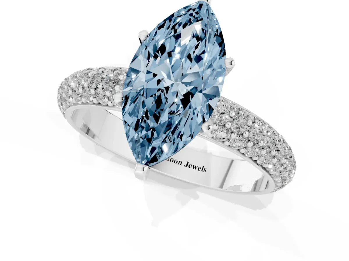 Fancy Blue Marquise Cut Diamond Solitaire Ring with Prong Setting and Pavé Band Silver