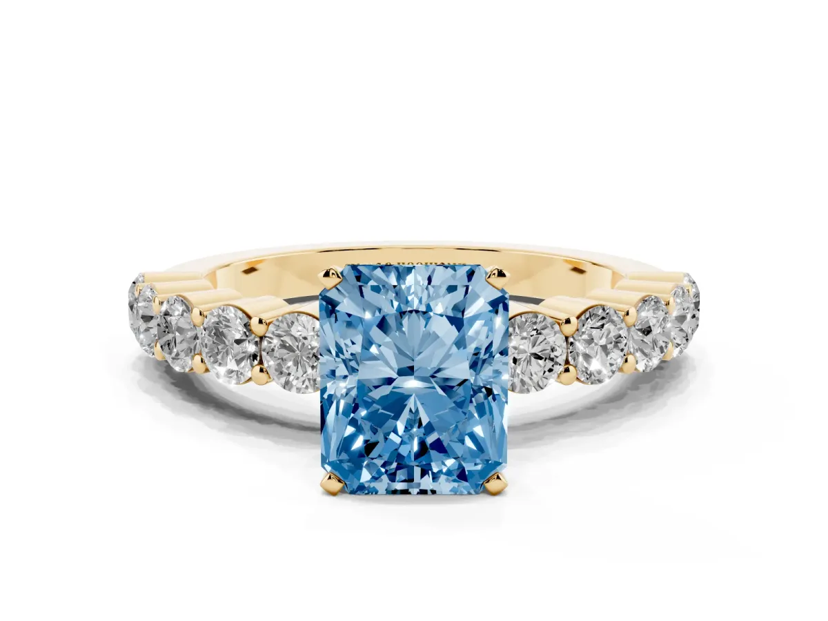 Fancy Blue Radiant Cut Diamond Solitaire Ring with Shared Prong Round Side Stones Yellow gold