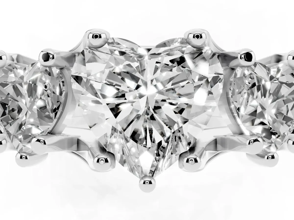 Heart Cut Diamond Three-Stone Ring with Channel Set Band and Four-Prong Setting Silver