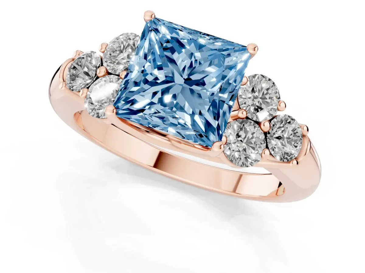 Fancy Blue Princess Cut Cut Diamond Cluster Ring with Round Accent Stones and Prong Setting on a Classic Band Rose gold