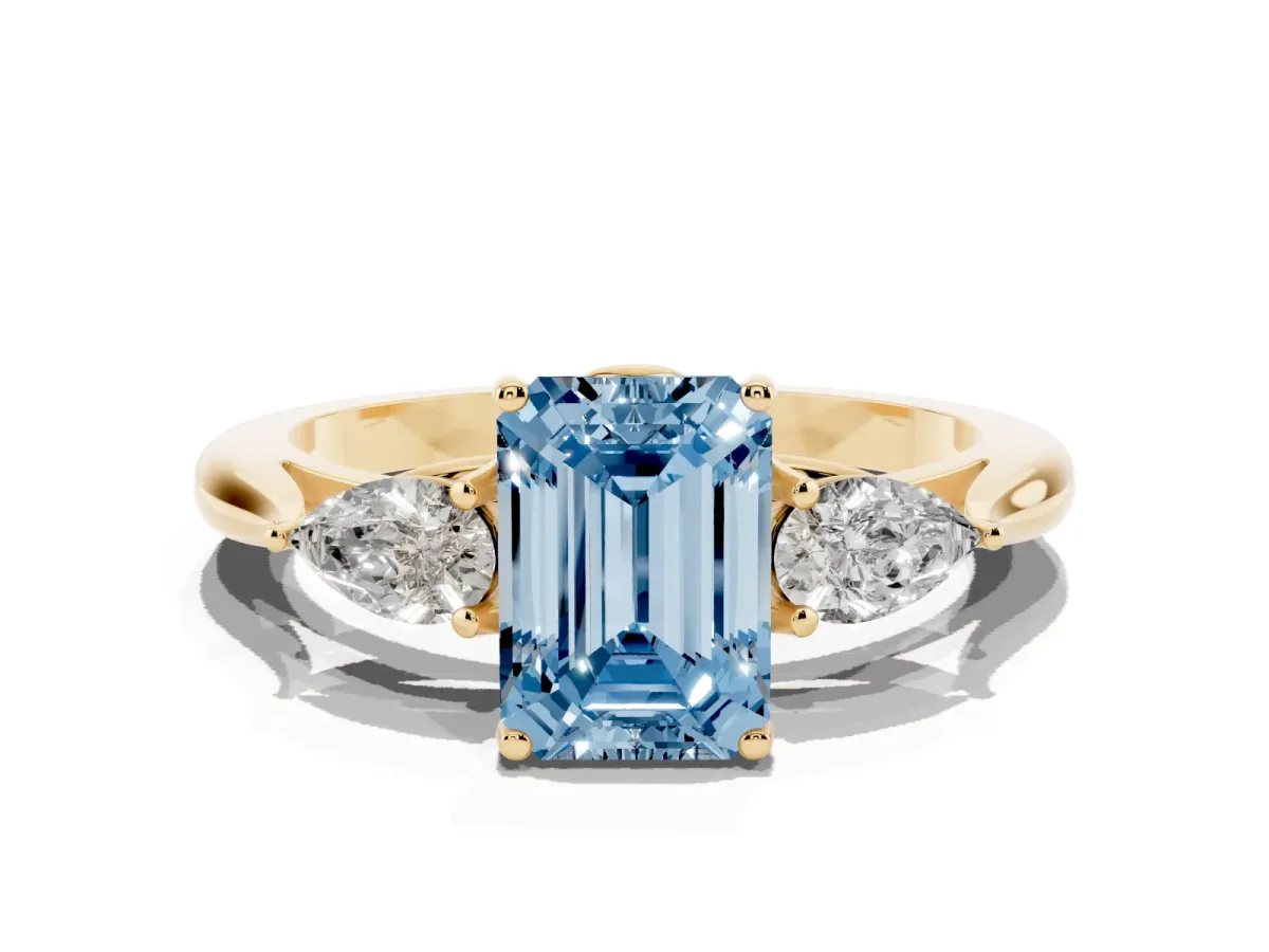 Fancy Blue Three-Stone Emerald Cut Brilliant Diamond Solitaire Ring with Tapered Band and Four-Prong Setting Yellow gold