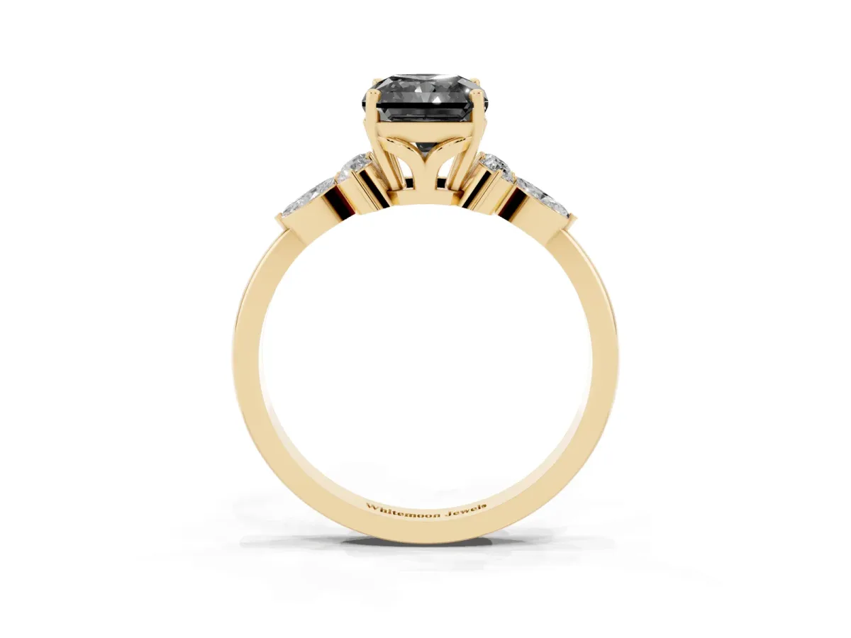 Fancy Black Radiant Cut Brilliant Diamond Solitaire Ring with Pear Side Stones and Four-Prong Setting Yellow gold