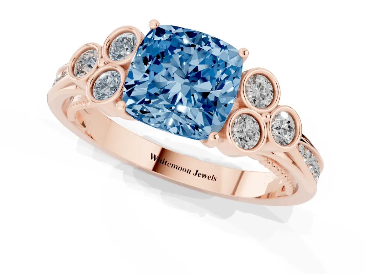 Fancy Blue Cushion Cut Cut Diamond Engagement Ring with Bezel Set Round Side Stones and Prong Setting Rose gold