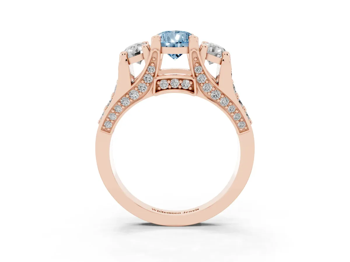 Fancy Blue Pear Cut Diamond Three-Stone Ring with Channel Set Band and Four-Prong Setting Rose gold