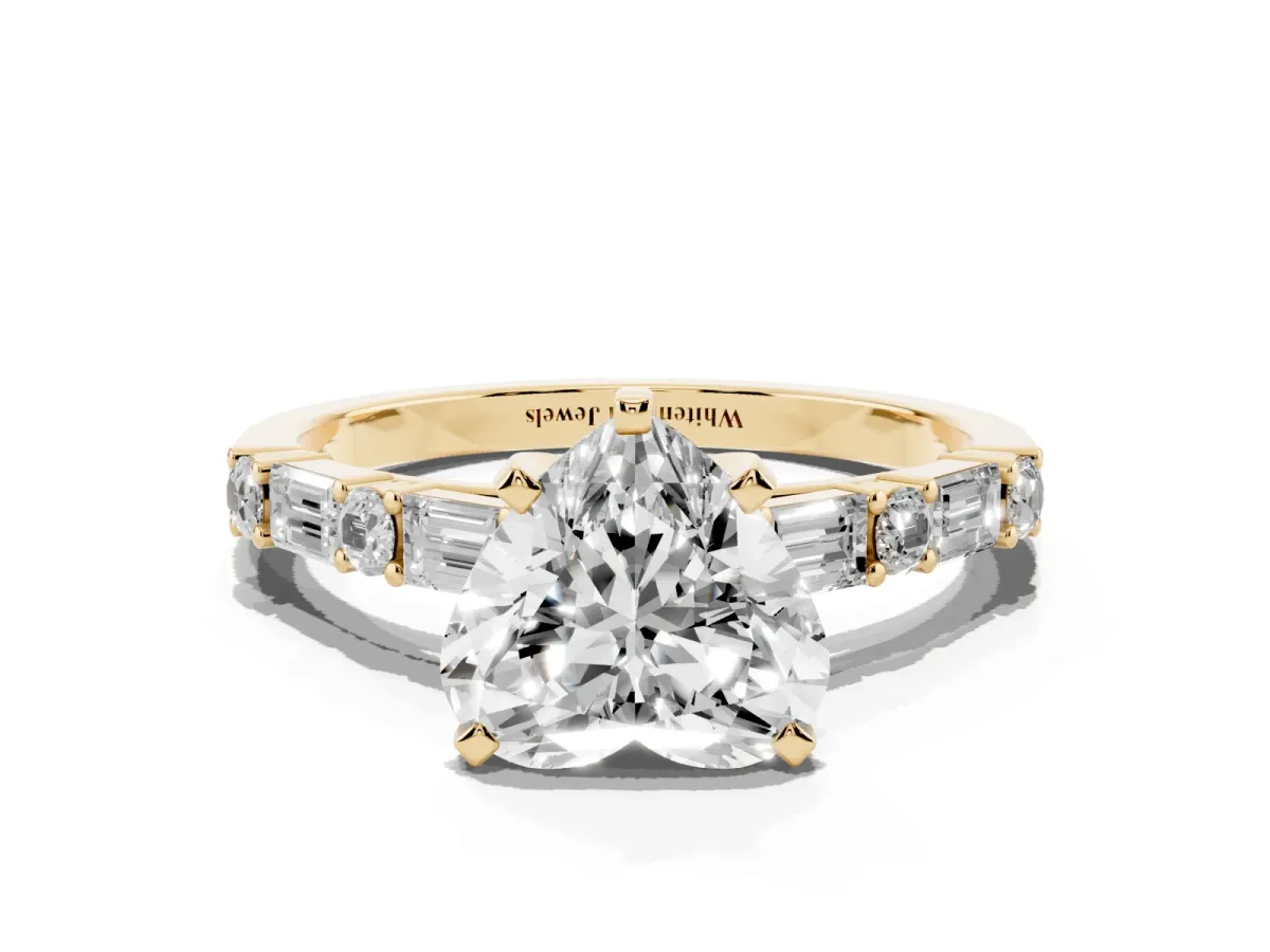 Heart Cut Diamond Solitaire with Side Baguettes and Channel Set Band Yellow gold