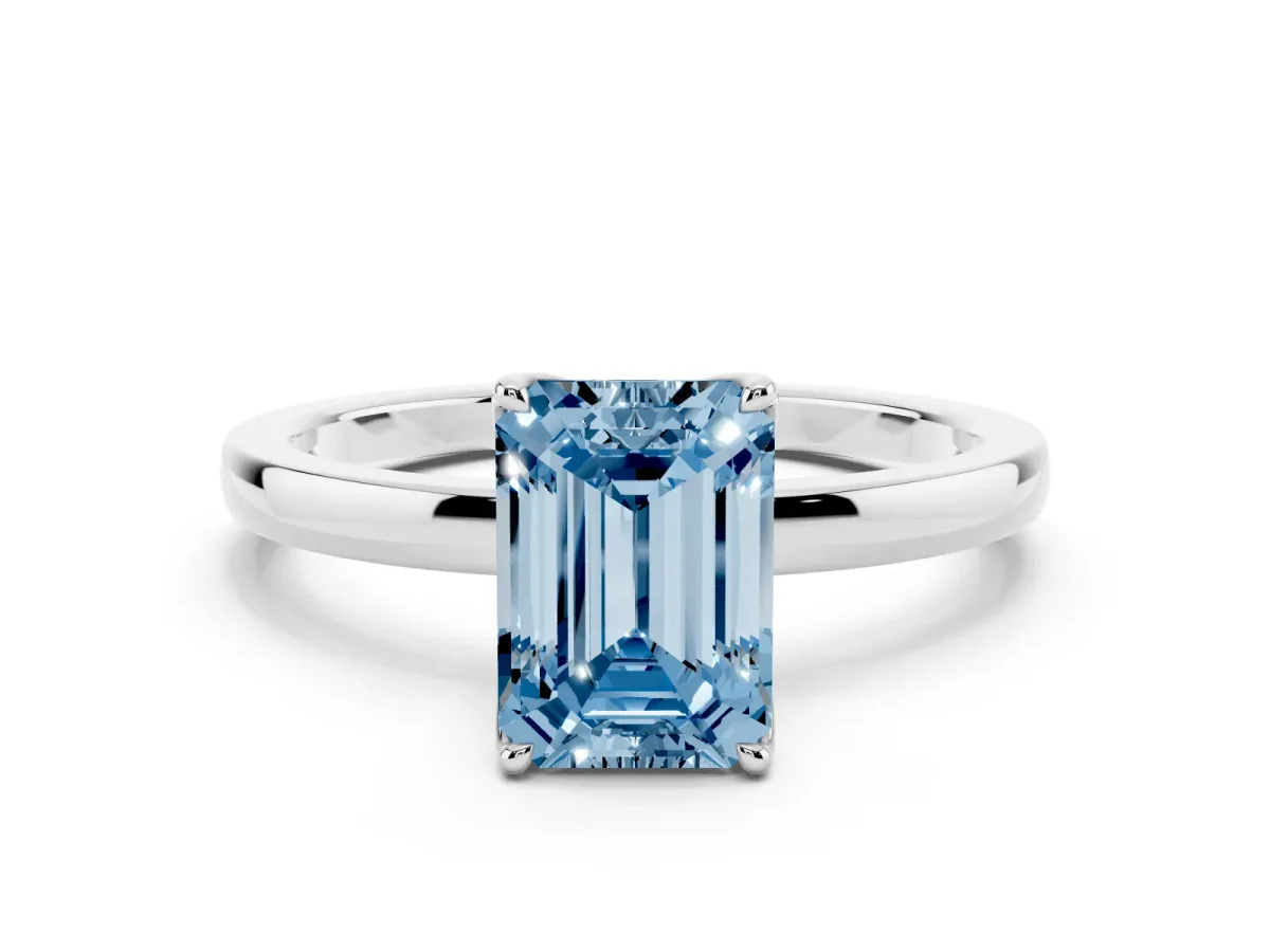 Fancy Blue Emerald Cut Diamond Solitaire Ring with Thin Band and Prong Setting Silver