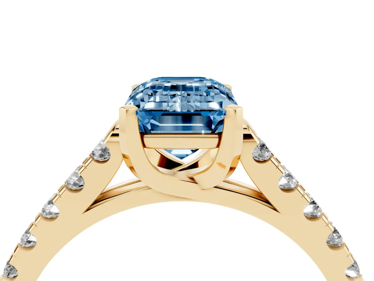 Fancy Blue Emerald Cut Diamond Pavé Band Solitaire Ring with Prong Setting Yellow gold