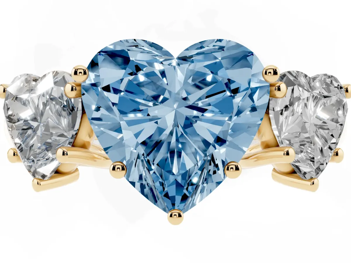 Fancy Blue Three-Stone Heart Cut Diamond Engagement Ring with Prong Setting Yellow gold