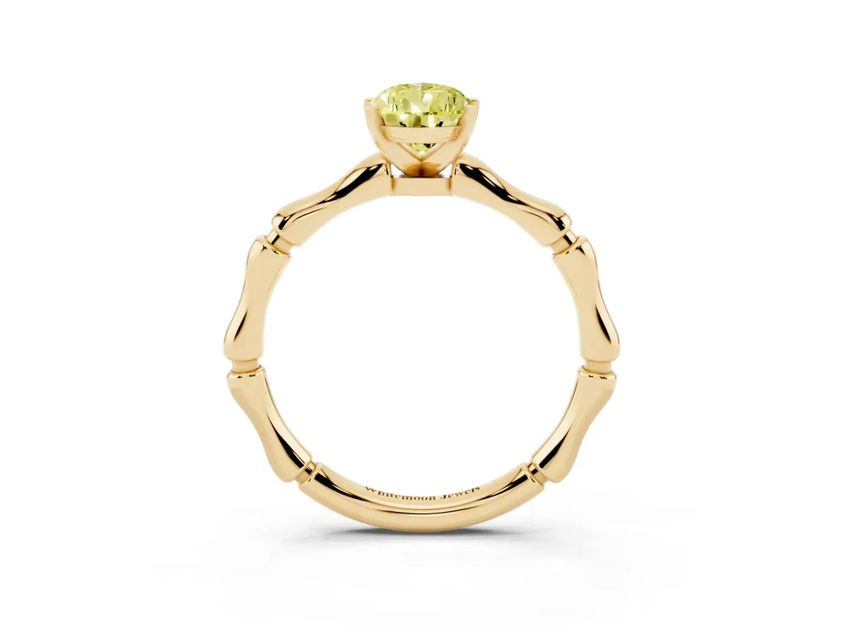 Fancy Yellow Pear Cut Solitaire Diamond Ring with Bamboo Band and Four-Prong Setting Yellow gold