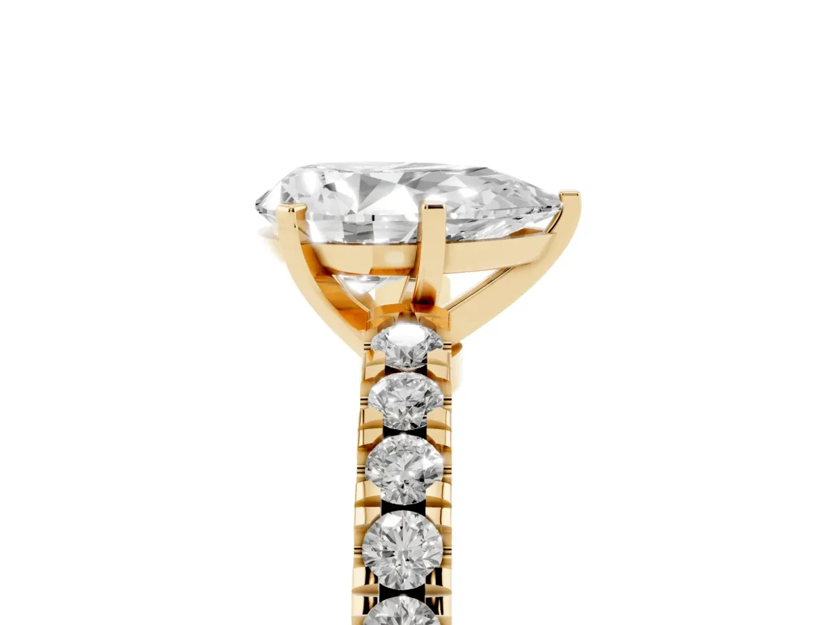 Pear Cut Solitaire Diamond with Pavé Band and Four-Prong Setting Yellow gold