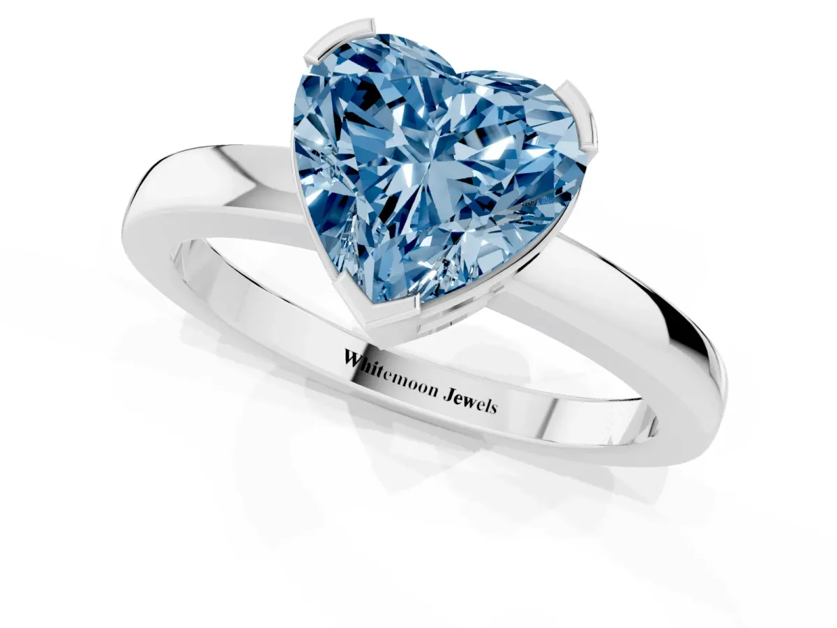 Fancy Blue Heart Cut Cut Solitaire Ring with Four-Prong Setting and Classic Band Silver