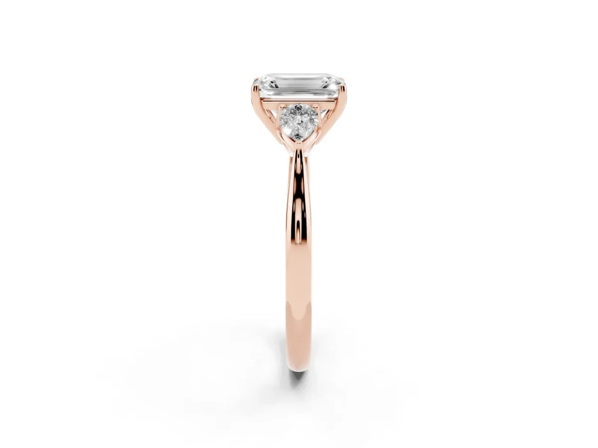 Three-Stone Emerald Cut Brilliant Diamond Solitaire Ring with Tapered Band and Four-Prong Setting Rose gold