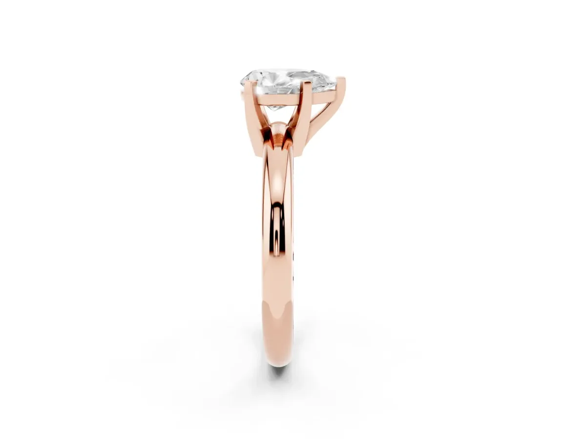 Pear Cut Diamond Solitaire Engagement Ring with Round Band and Four-Prong Setting Rose gold