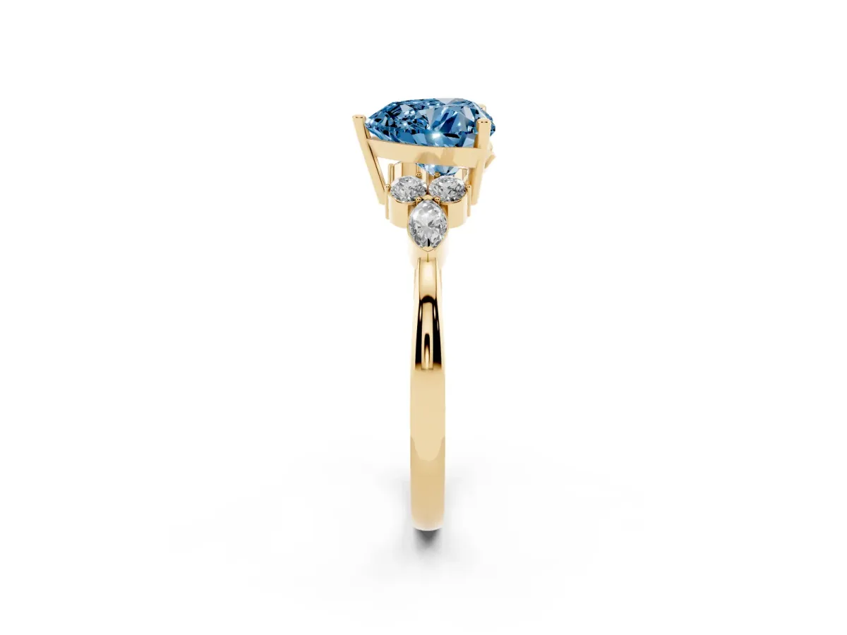 Fancy Blue Heart Cut Brilliant Diamond Solitaire Ring with Pear Side Stones and Four-Prong Setting Yellow gold