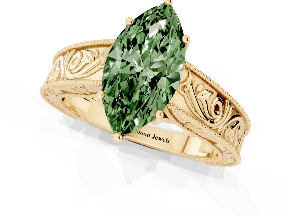 Fancy Green Marquise Cut Diamond Solitaire Ring with Engraved Band and Four-Prong Setting Yellow gold