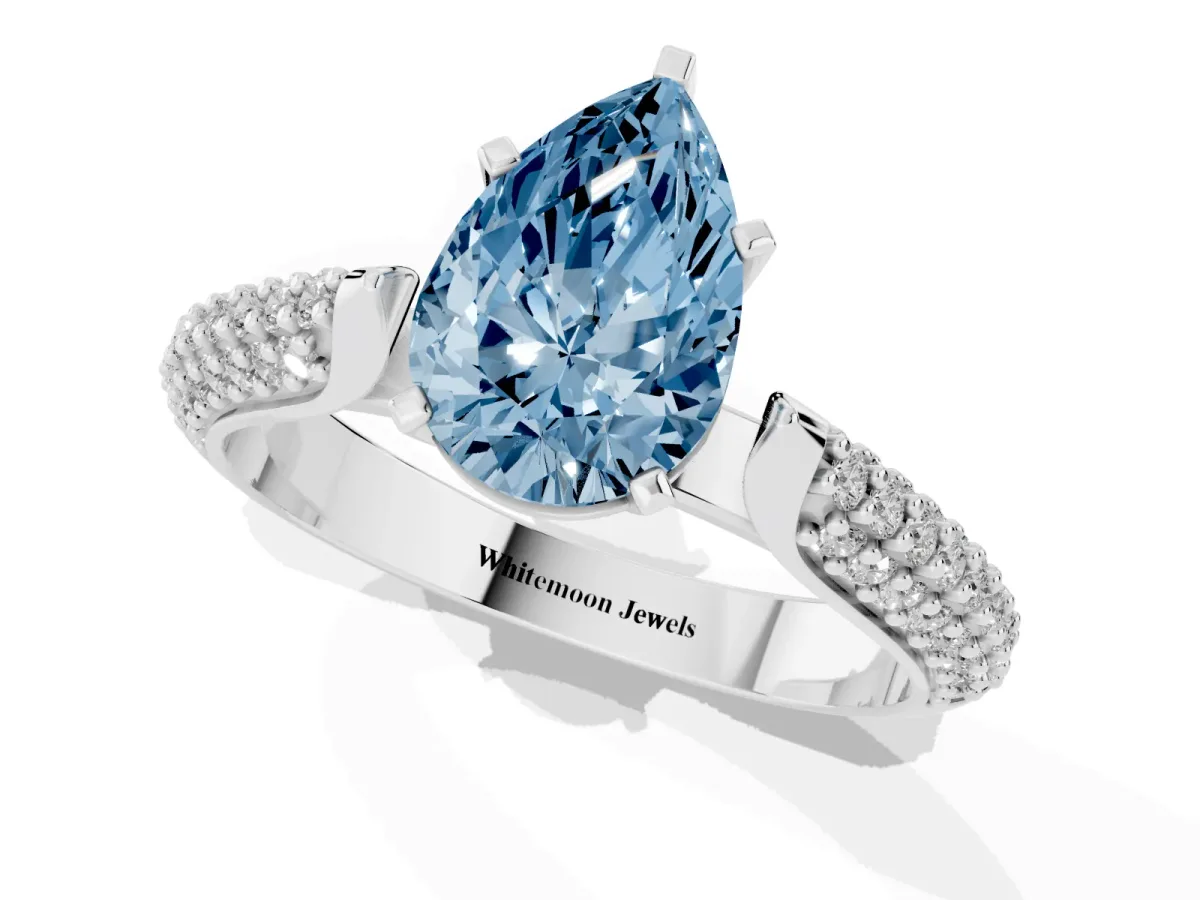 Fancy Blue Pear Cut Diamond Solitaire Engagement Ring with Multi-Row Round Pavé Band and Prong Setting White gold
