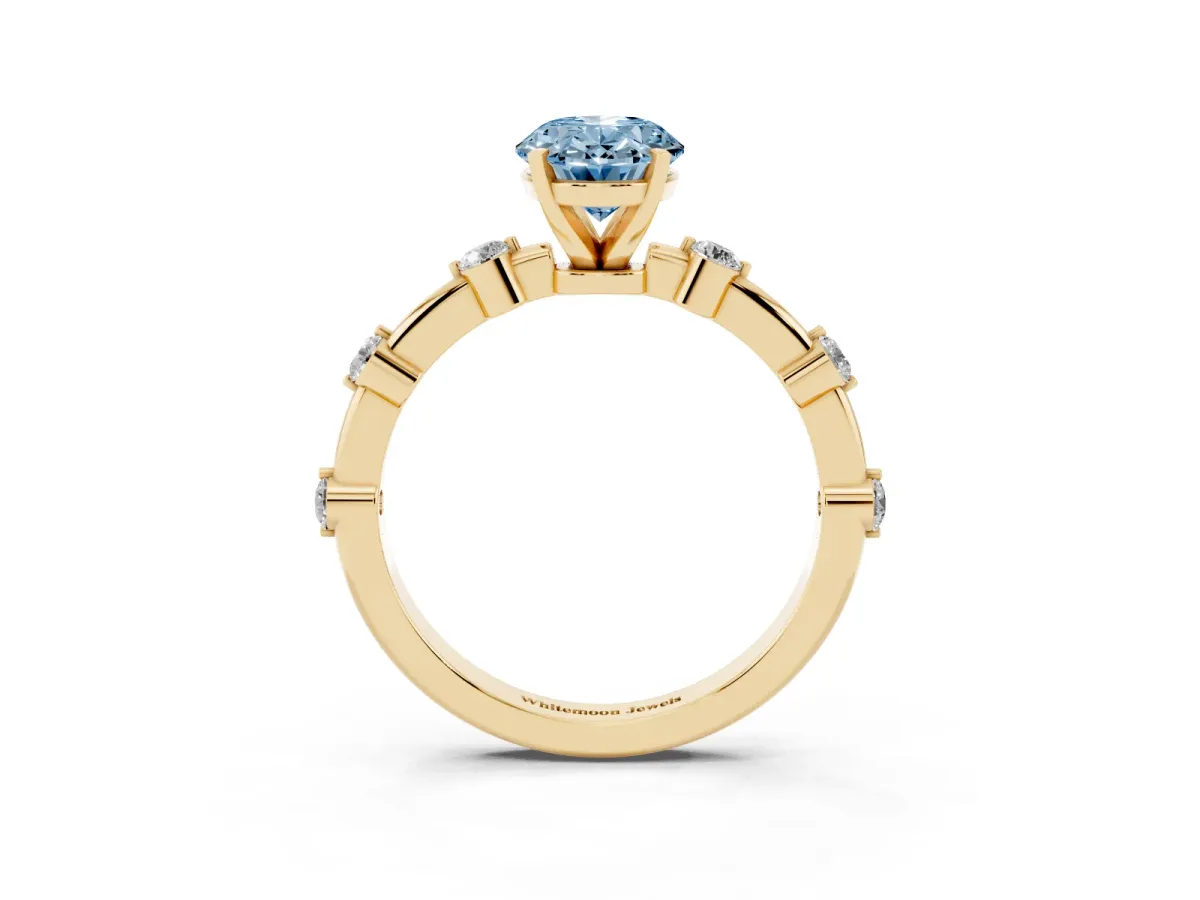 Fancy Blue Oval Cut Solitaire Diamond Ring with Bezel Set Side Stones and Prong Setting Yellow gold