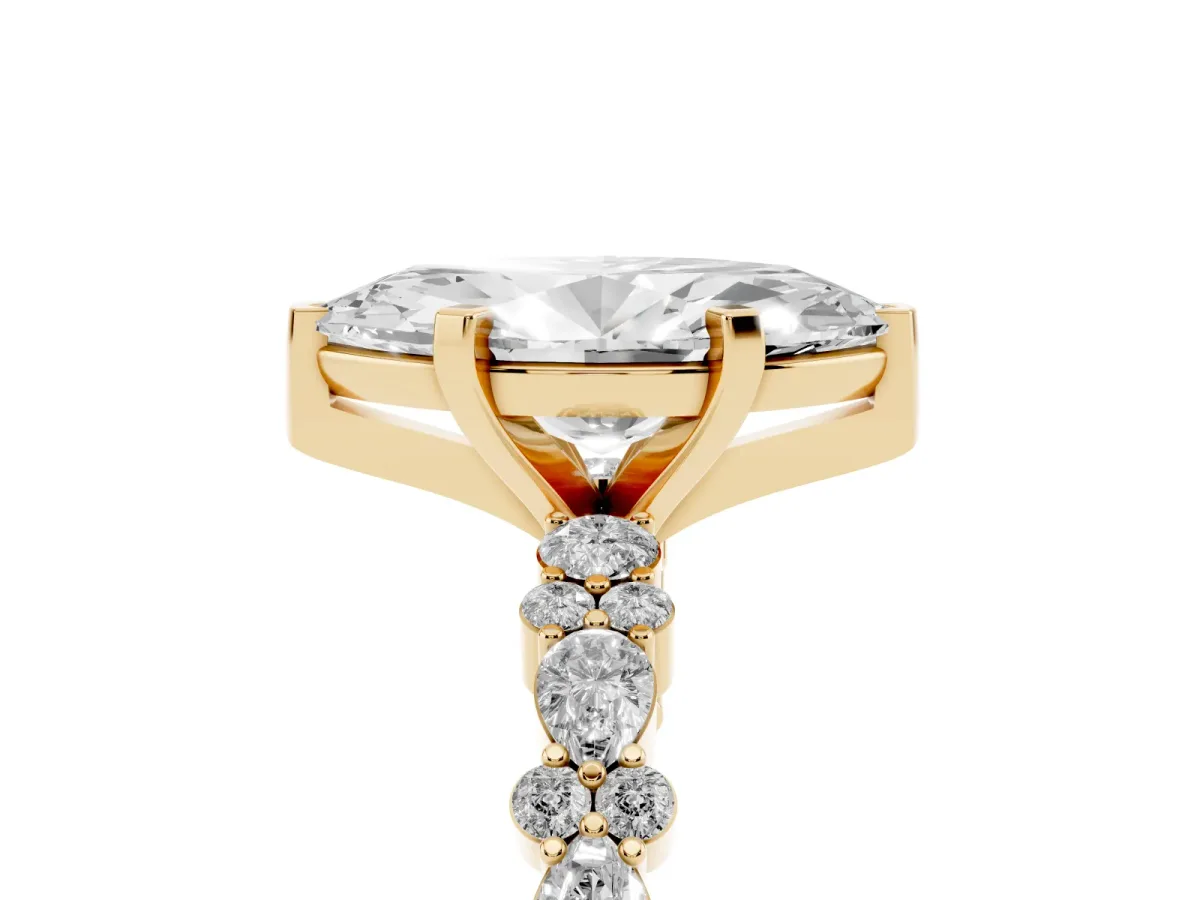 Marquise Cut Diamond Side Stone Solitaire Ring with Round and Four-Prong Setting Yellow gold