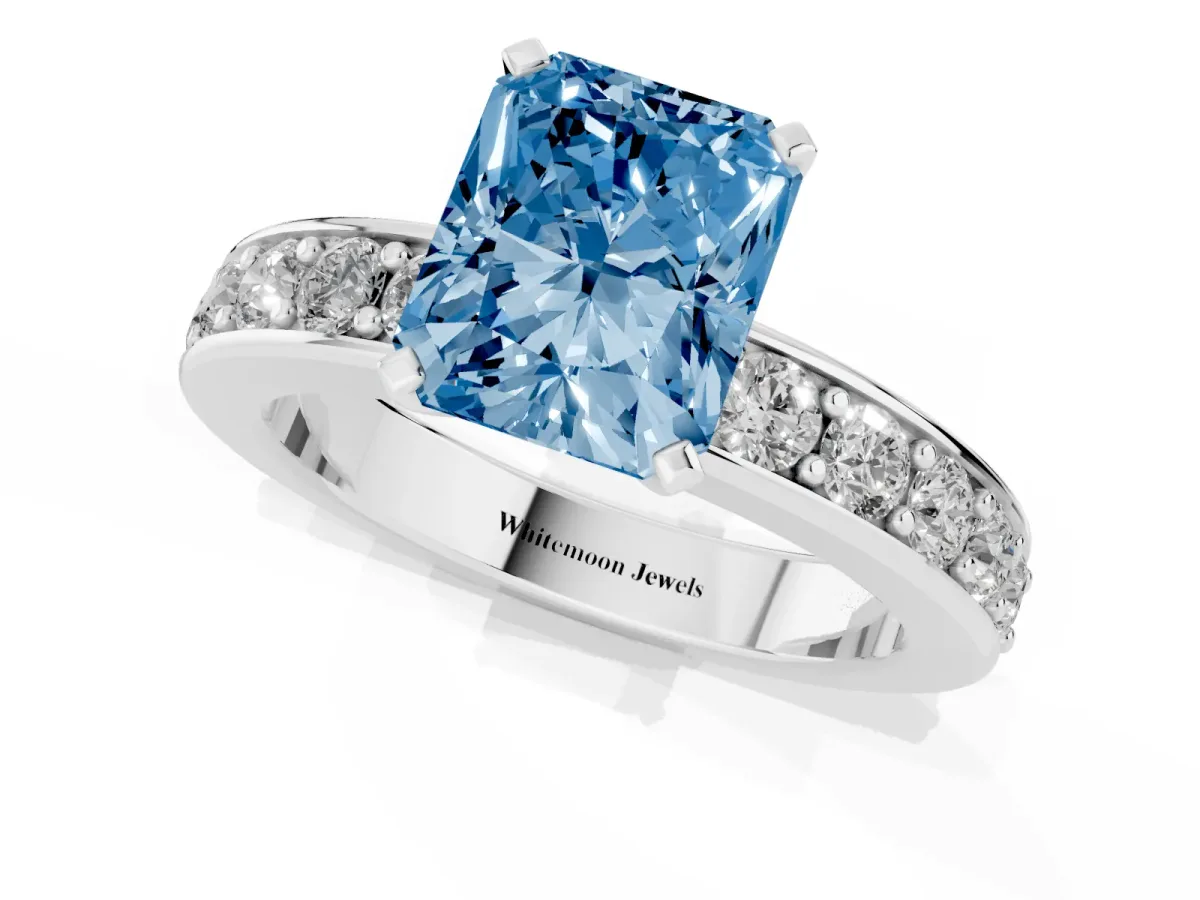 Fancy Blue Radiant Cut Diamond Engagement Ring with Channel Set Round Band and Prong Setting Silver