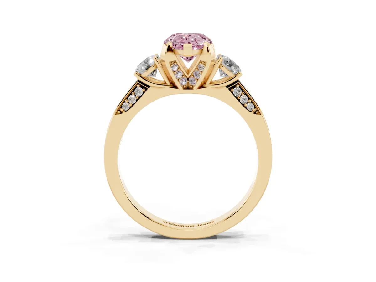 Fancy Pink Pear Cut Brilliant Three-Stone Diamond Ring with Pavé Band and Four-Prong Setting Yellow gold