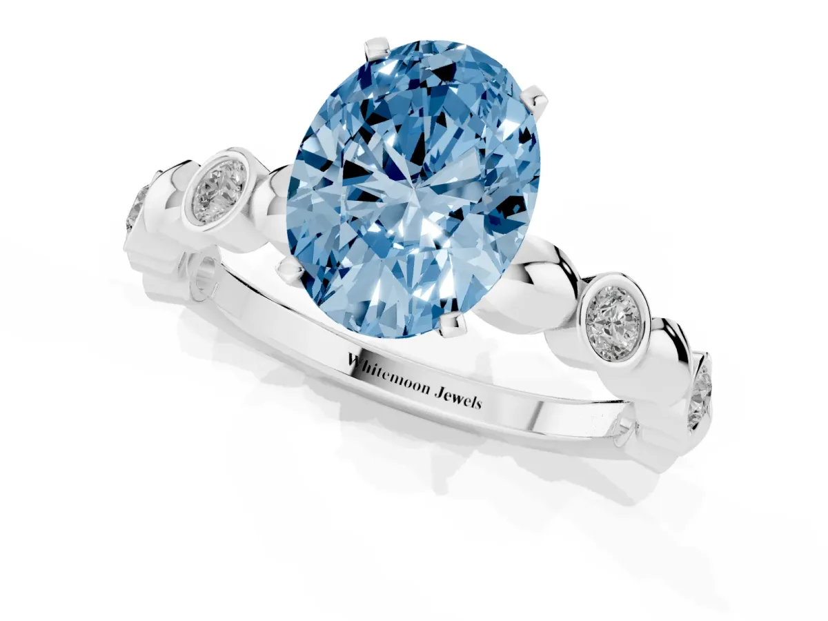 Fancy Blue Oval Cut Solitaire Bezel-Set Diamond Ring with Beaded Band and Four-Prong Setting Silver