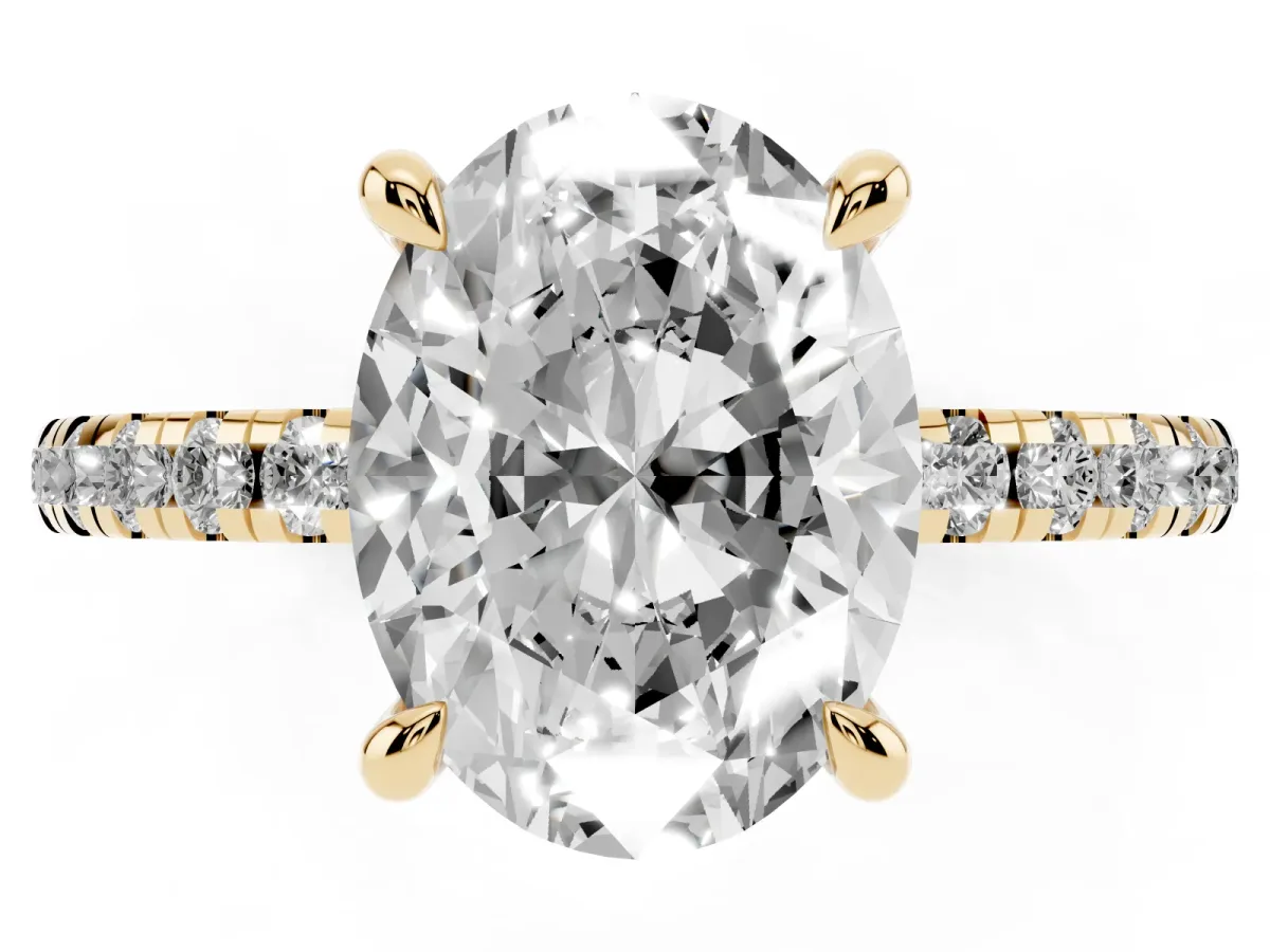 Oval Cut Diamond Brilliant Solitaire Ring with Pavé Band and Four-Prong Setting Yellow gold