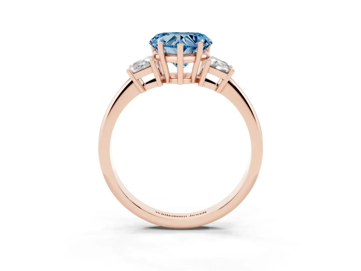 Fancy Blue Heart Cut Diamond Three-Stone Ring with Trapezoid Side Stones and Prong Setting Rose gold