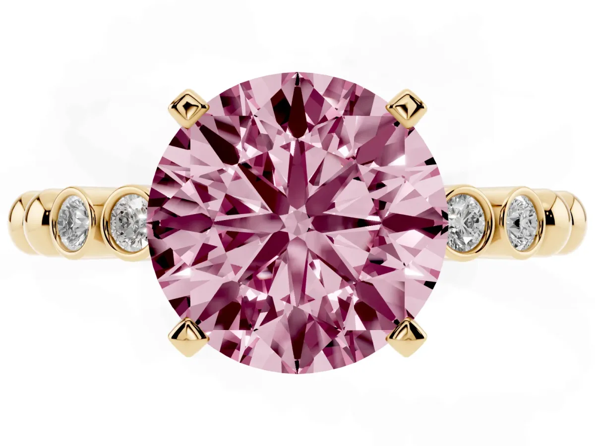 Fancy Pink Round Cut Solitaire Bezel Accent Diamond Engagement Ring with Beaded Band and Four-Prong Setting Yellow gold